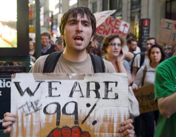 Occupy Wall Street supporters march through lower Manhattan