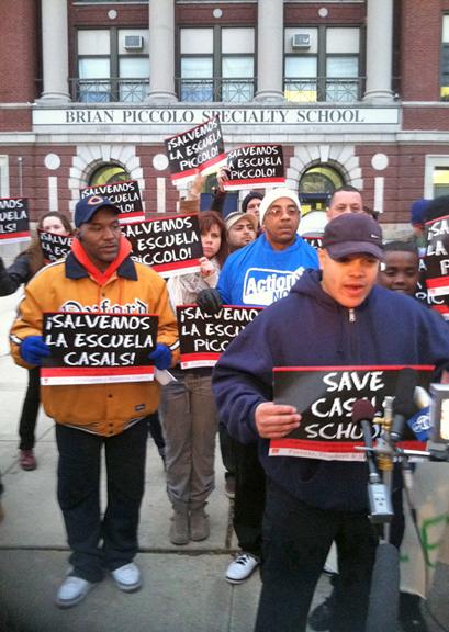 Parents and supporters speak to the press outside the Piccolo elementary school in Chicago