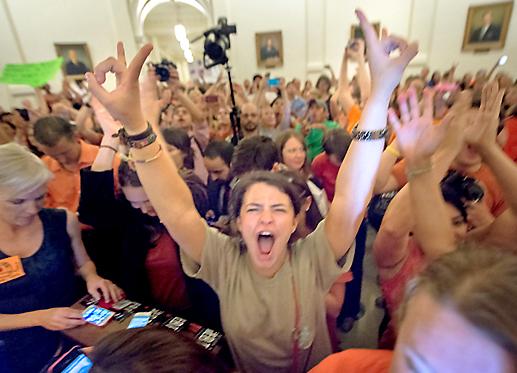 Protesters pack the Texas Capitol building to obstruct a vote on an anti-abortion bill