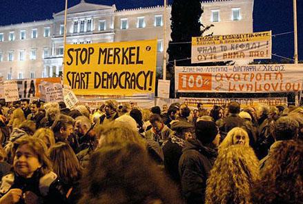 Rallying in front of the parliament building in opposition to austerity
