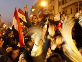 Masses of people fill Tahrir Square, cheering the fall of dictator Hosni Mubarak