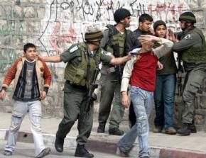 IDF soldiers stop and arrest a group of young Palestinian men