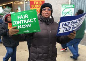 Workers protest Illinois Gov. Bruce Rauner outside the Hilton Hotel in Chicago